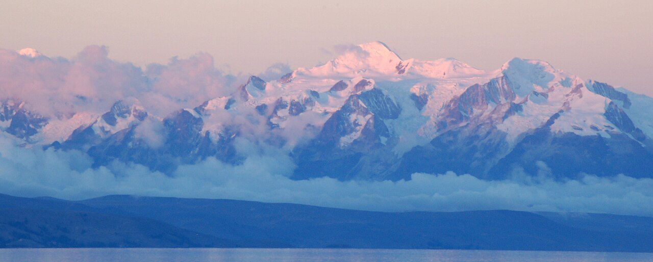 https://overlandtraveltips.com/wp-content/uploads/2026/08/1280px-Bolivia_Cordillera_Real_y_Lago_Titicaca.jpg