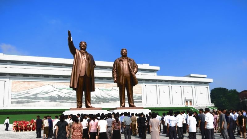 https://overlandtraveltips.com/wp-content/uploads/2026/08/131202121054-5-north-korea-tourism-kim-statues_1.jpg