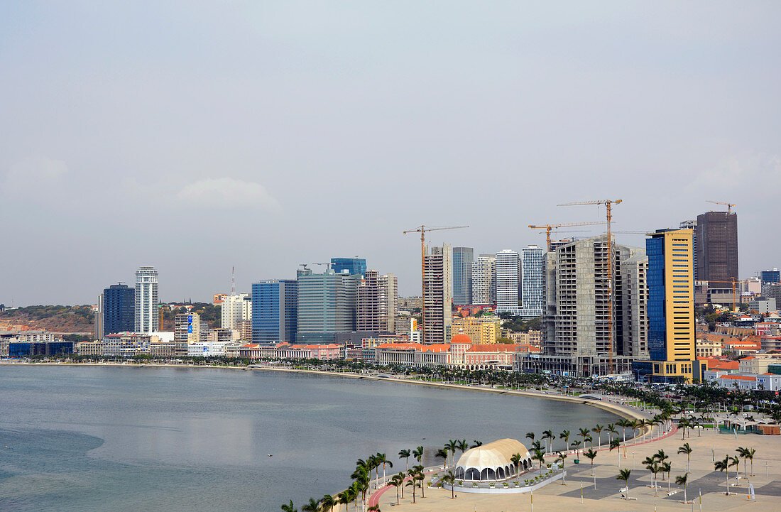 https://overlandtraveltips.com/wp-content/uploads/2026/08/71369162-Angola-Luanda-Province-Capital-Luanda-View-of-the-waterfront-called-marginal-modern-office-buildings-in-the.jpg
