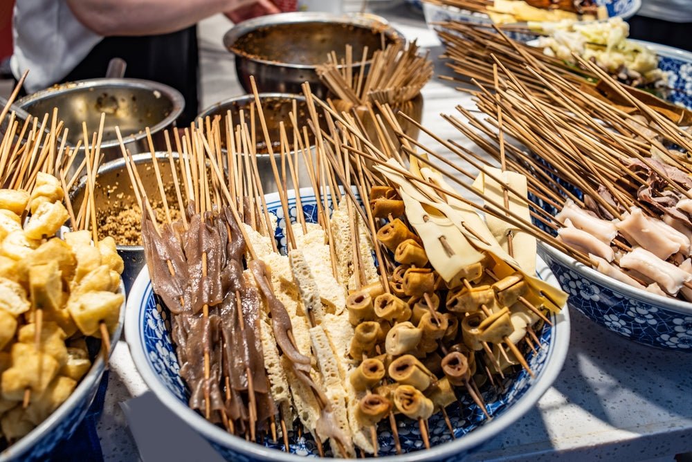 https://overlandtraveltips.com/wp-content/uploads/2026/08/Chuan_Chuan_Xiang_in_Jiefangbei_Food_Street_Chongqing_China.jpg