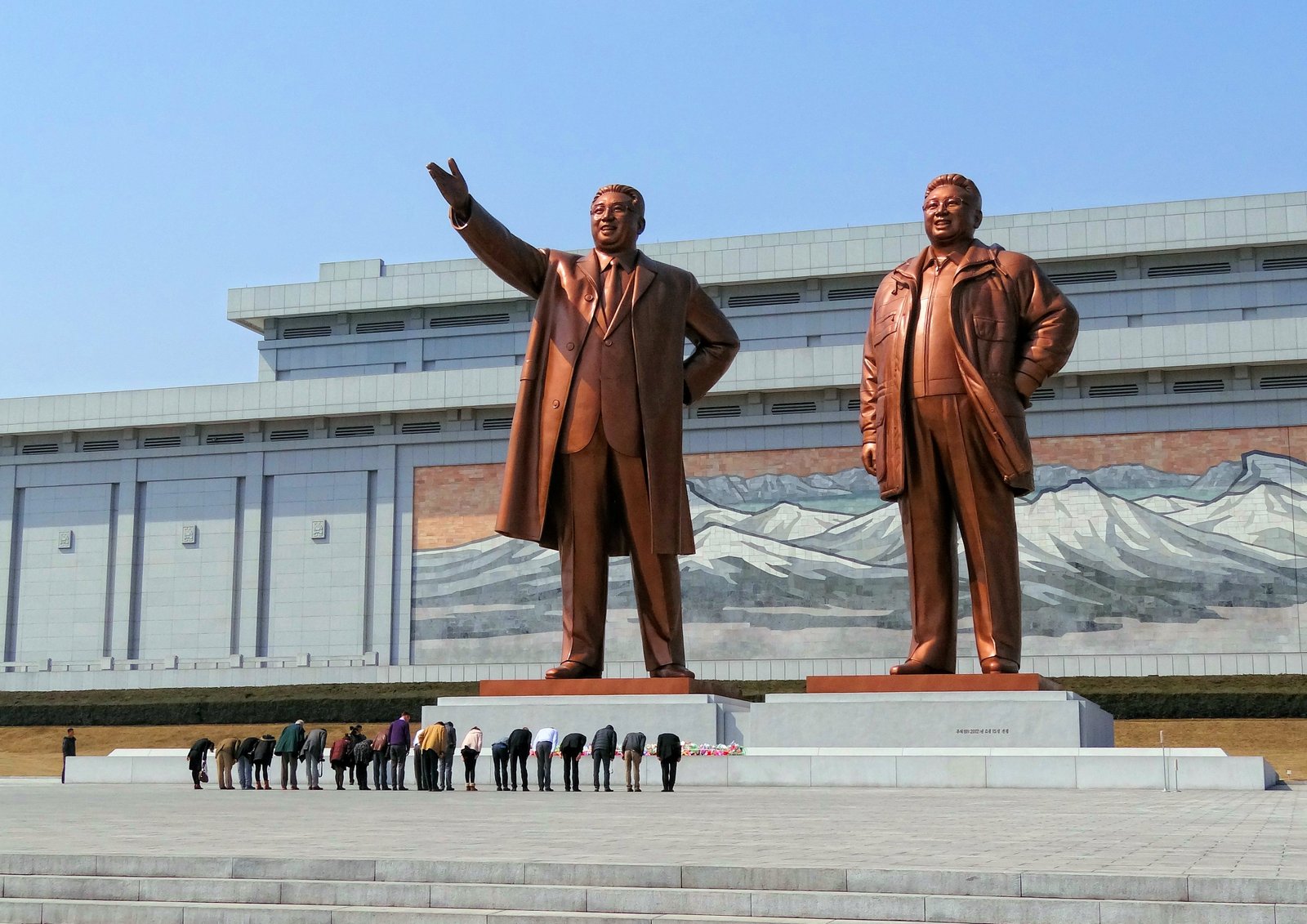 https://overlandtraveltips.com/wp-content/uploads/2026/08/Mansudae-Monument-Bow-2014.jpg