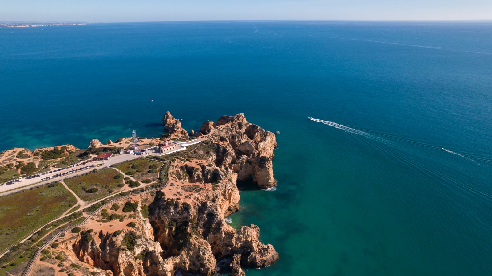 https://overlandtraveltips.com/wp-content/uploads/2026/08/Ponta_da_Piedade_aerial_view.jpg