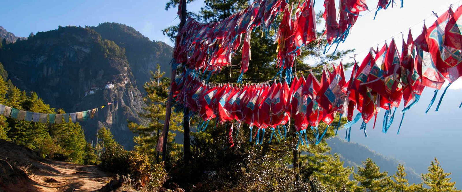 https://overlandtraveltips.com/wp-content/uploads/2026/08/flags-during-the-druk-path-in-bhutan-1704.jpg